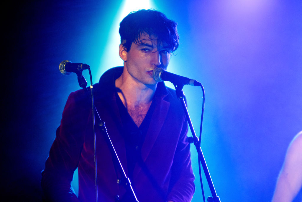 Ezra Miller sings with his band