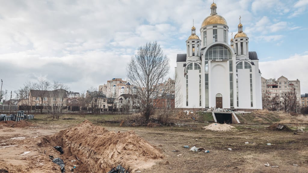 A grave with corpses near a church in Bucha, Ukraine.