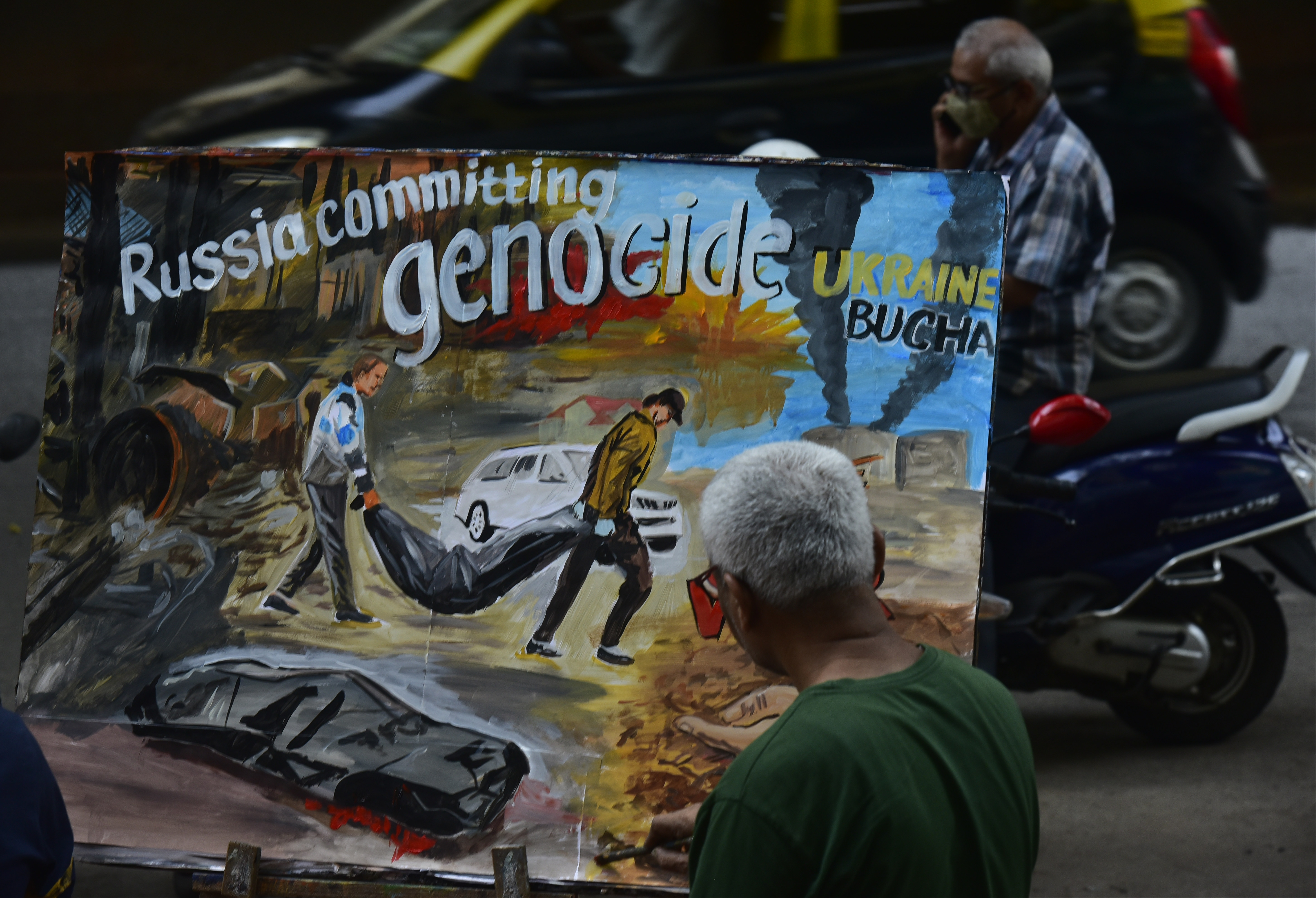 An artist in Mumbai paints a canvas in tribute to the victims of Bucha, Ukraine