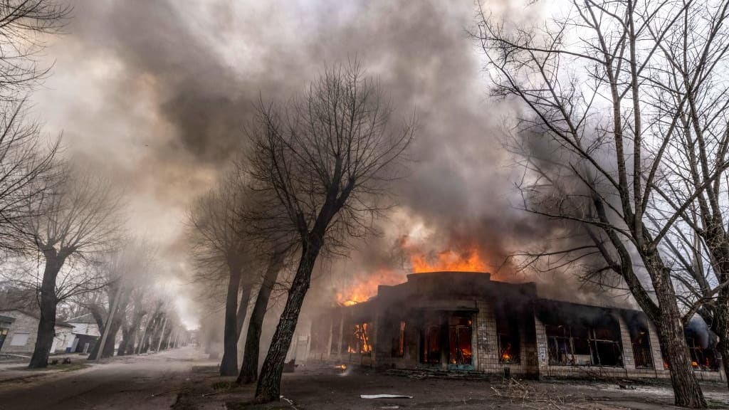 A house burns following shelling in the Donbas region of Ukraine.