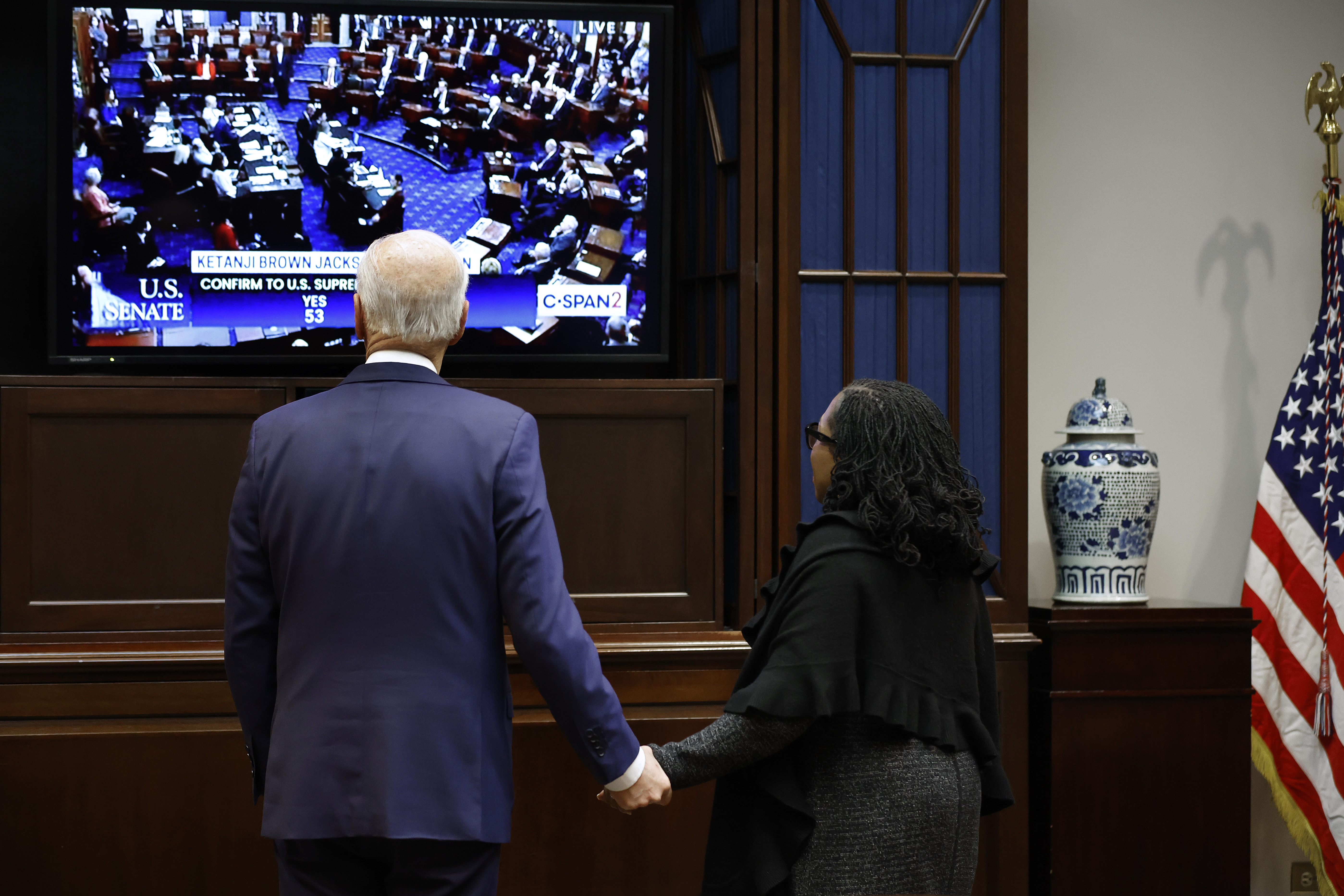 President Biden and Judge Ketanji Brown Jackson watch the Senate vote