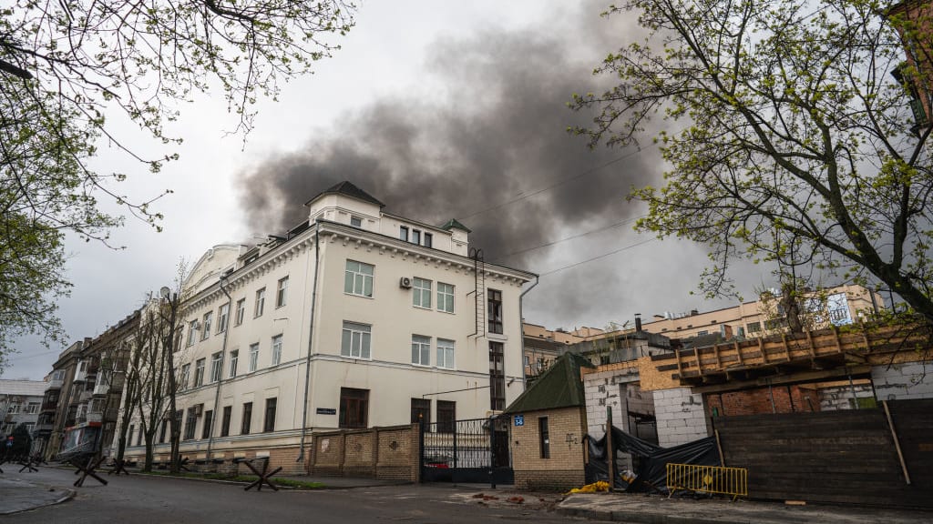 An apartment in Kharkiv on fire after being hit by Russian shelling.