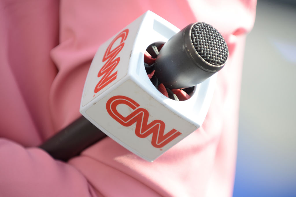 CNN presenter holding microphone.
