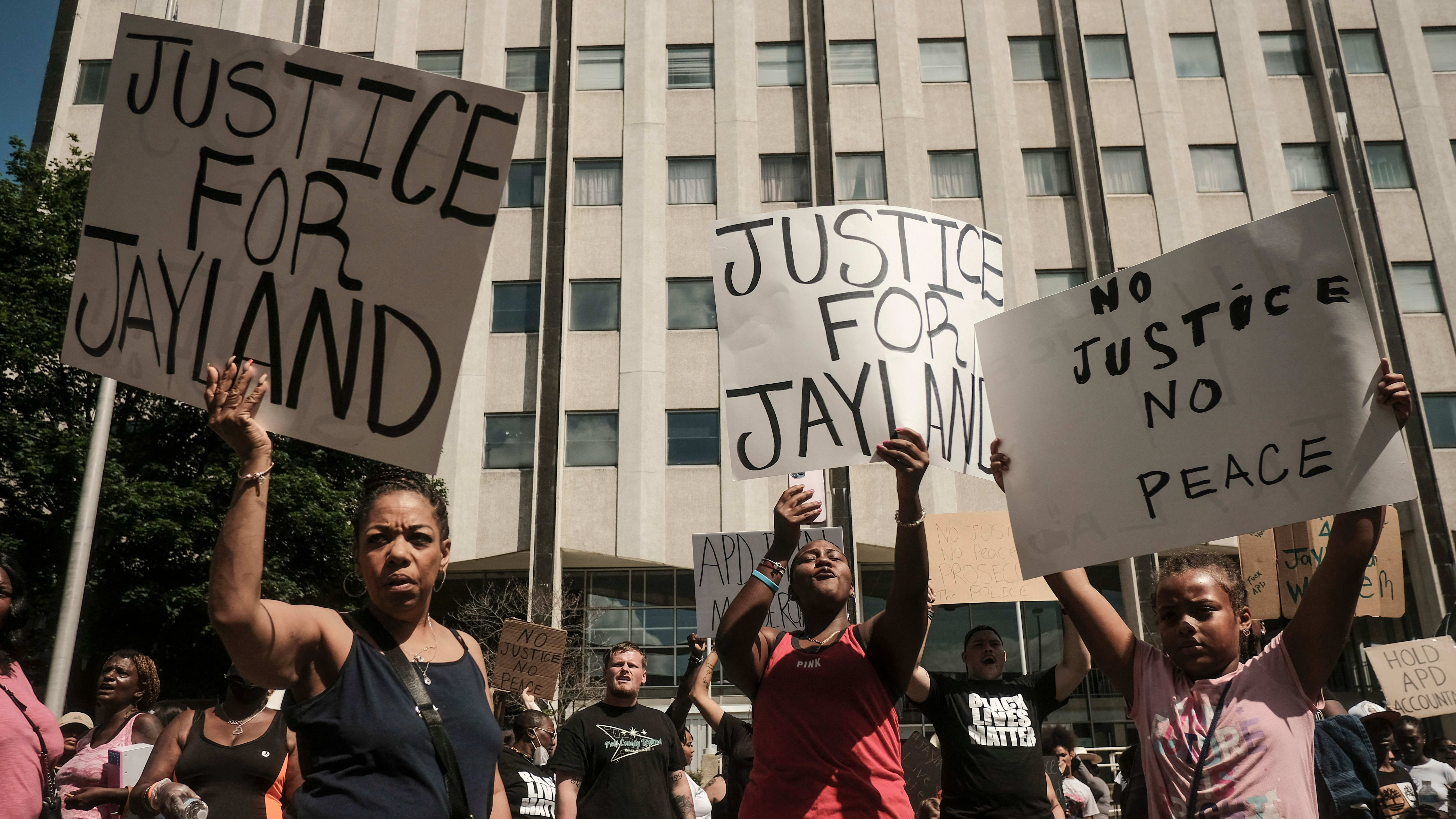 Demonstrators march in Akron, Ohio, following the police shooting of Jayland Walker.