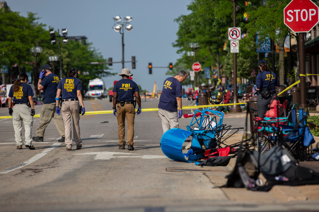FBI agents at the scene of a mass shooting in Highland Park, Illinois