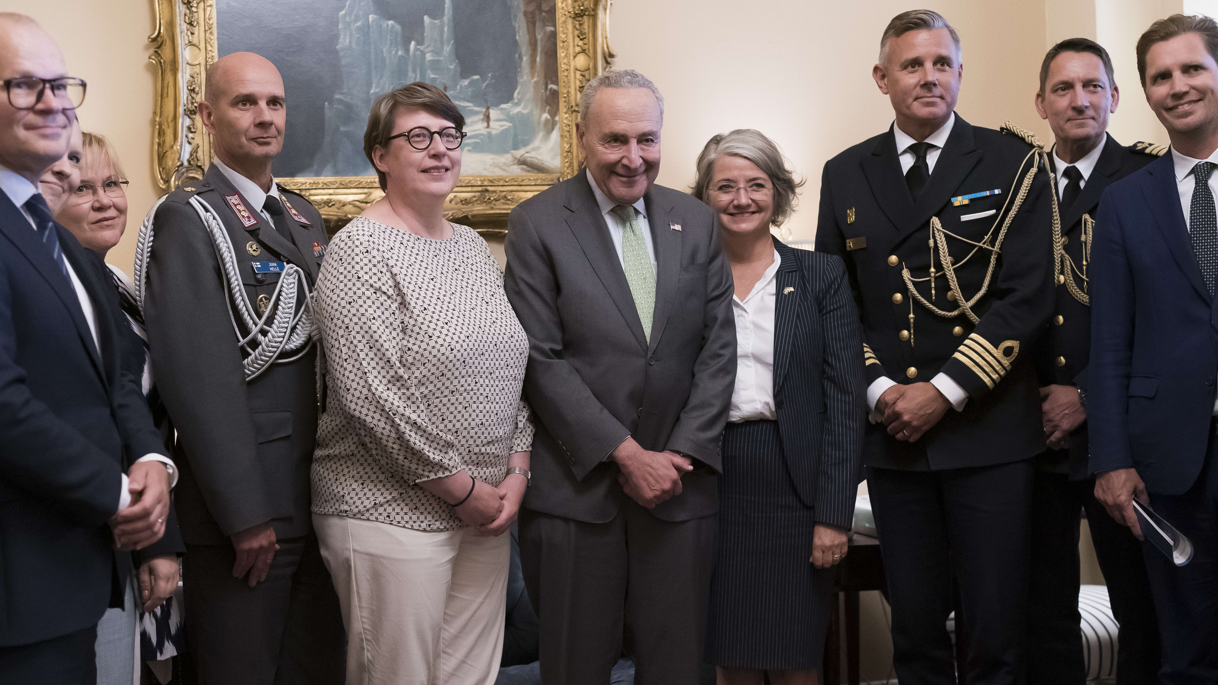 Senate Majority Leader Chuck Schumer, center, is flanked by Paivi Nevala, minister counselor of the Finnish Embassy, left, and Karin Olofsdotter, Sweden&#039;s ambassador to the U.S.