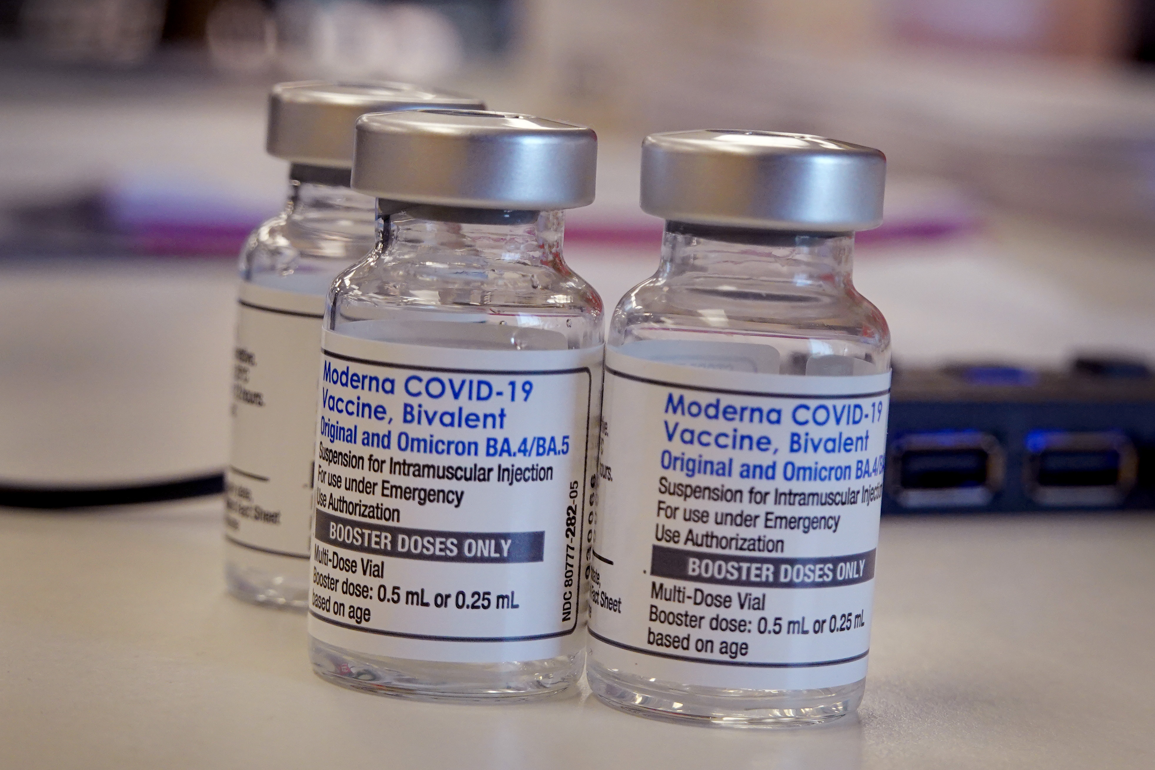 Vials of the Moderna COVID-19 booster vaccine await usage. 