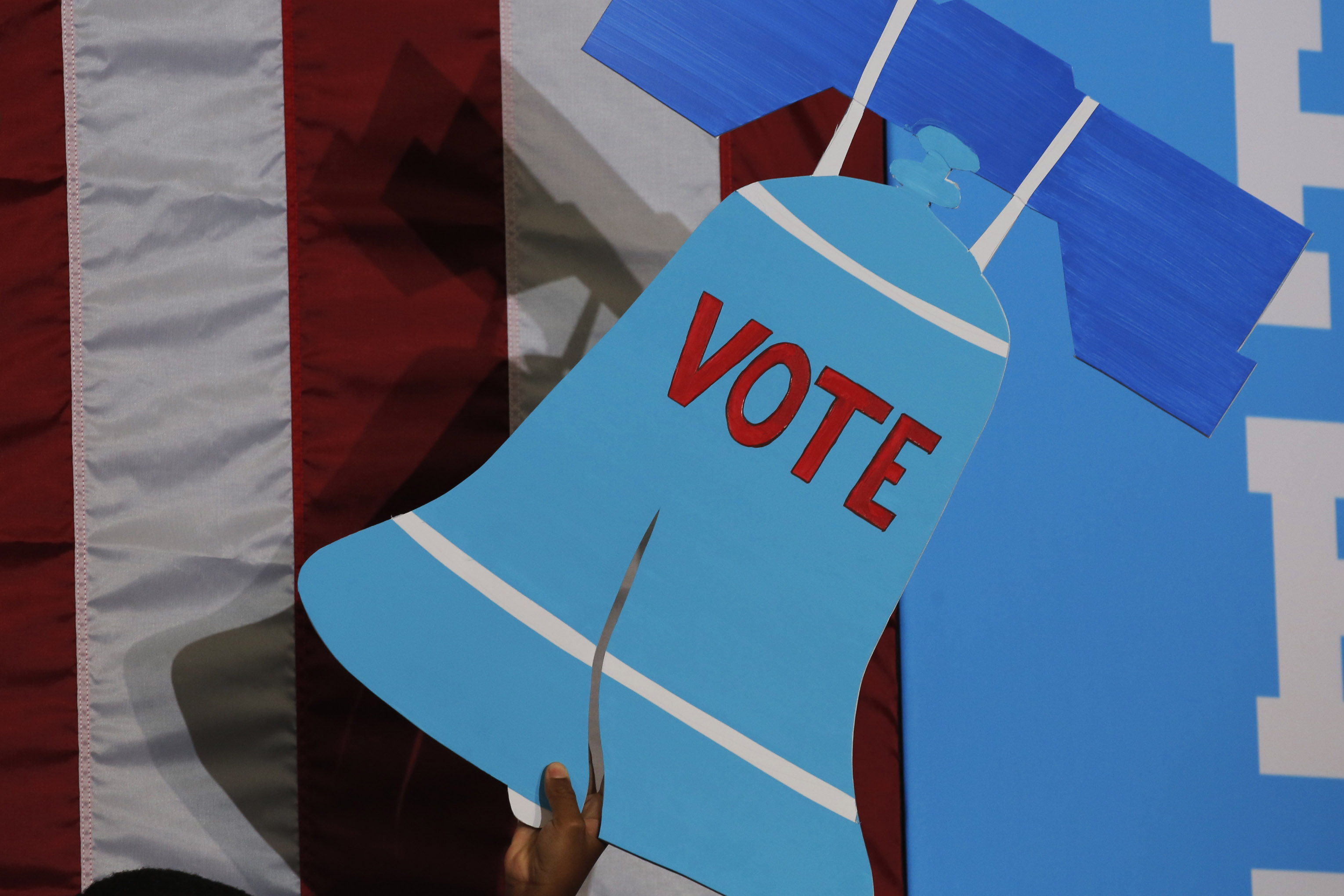 A sign depicting the Liberty Bell with the word &quot;vote.&quot;