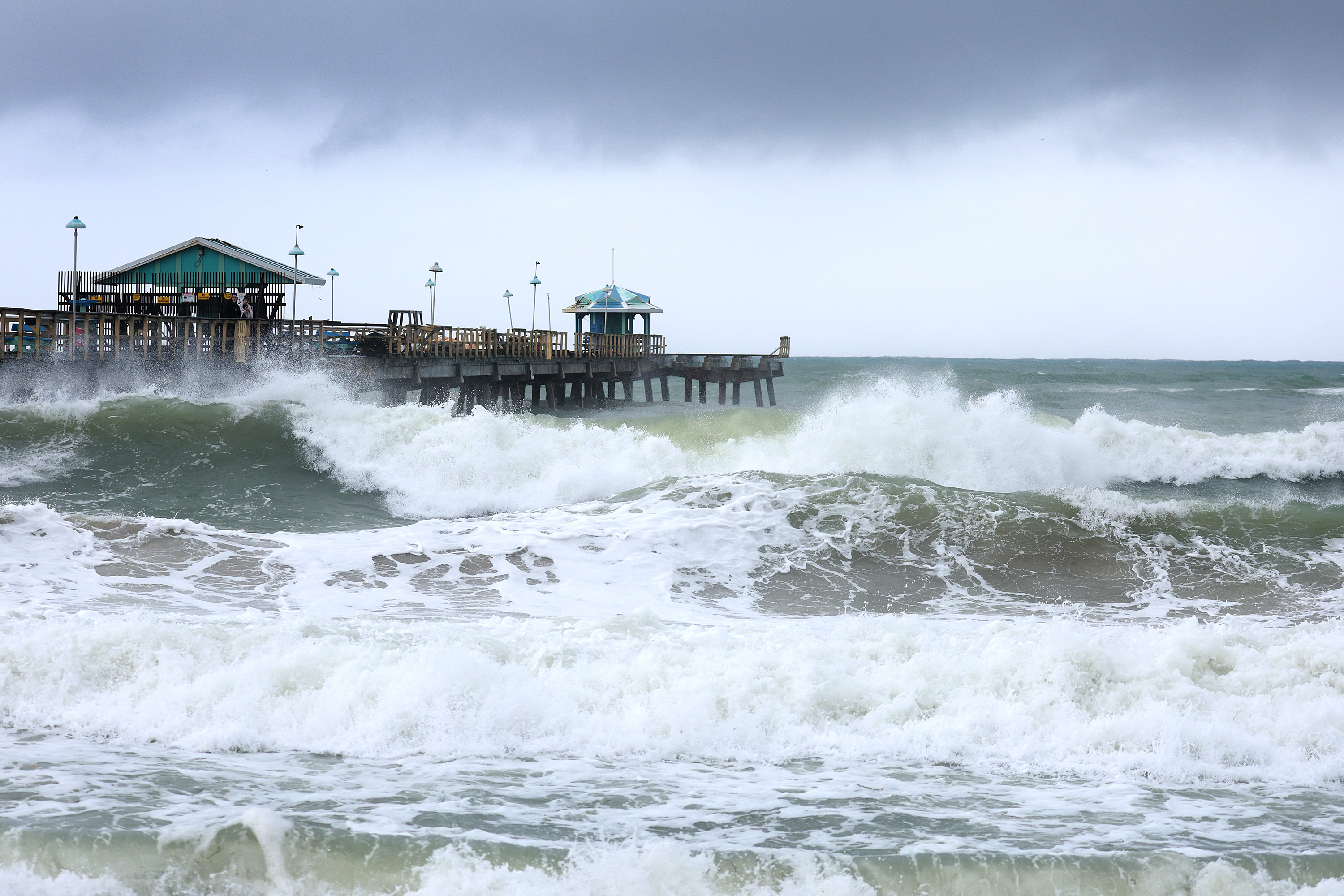 Waves batter the Florida coastline as Tropical Storm Nicole strengthens.