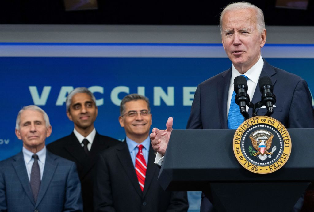 White House COVID advisers standing behind Biden.
