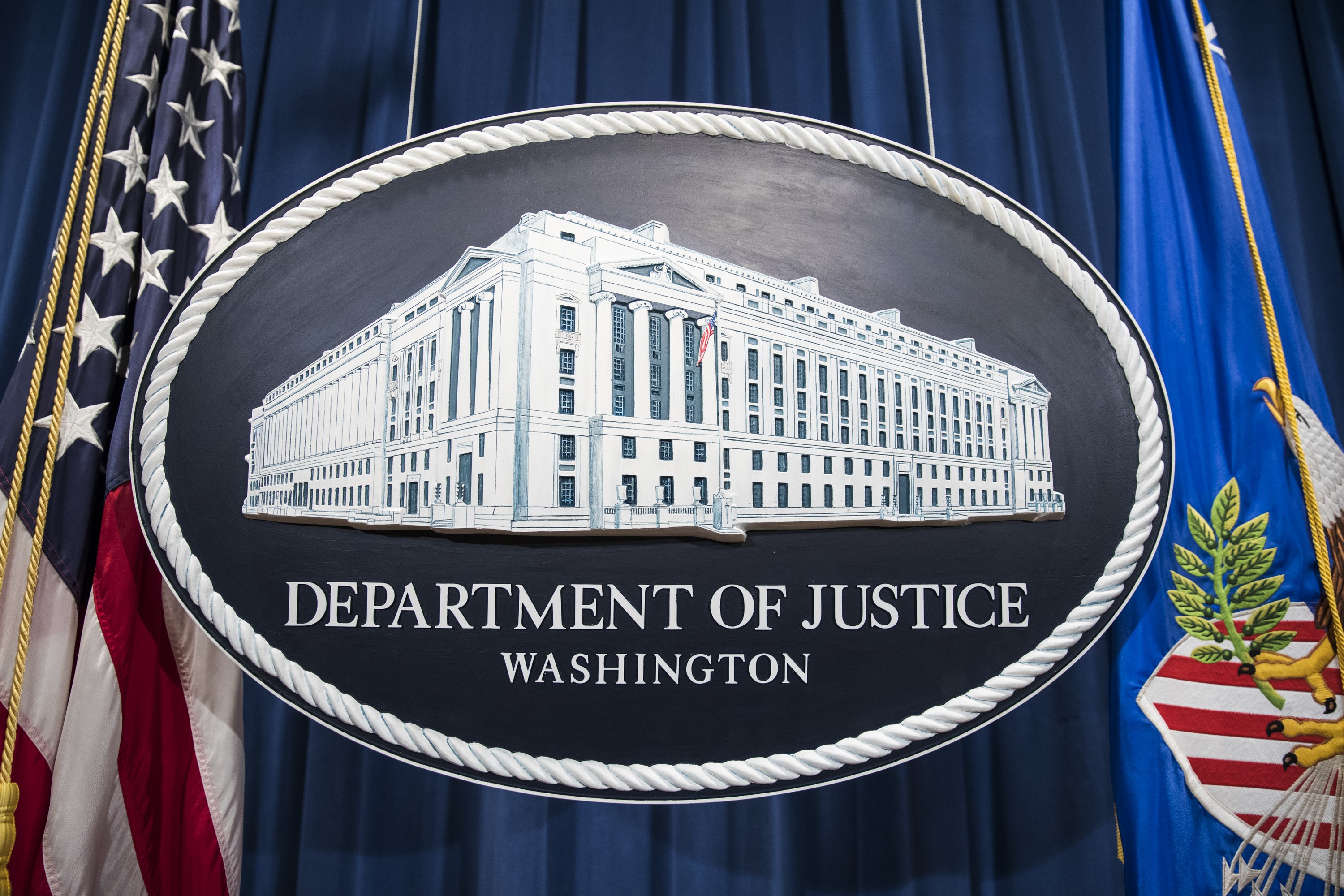 Logo of the U.S. Department of Justice. 