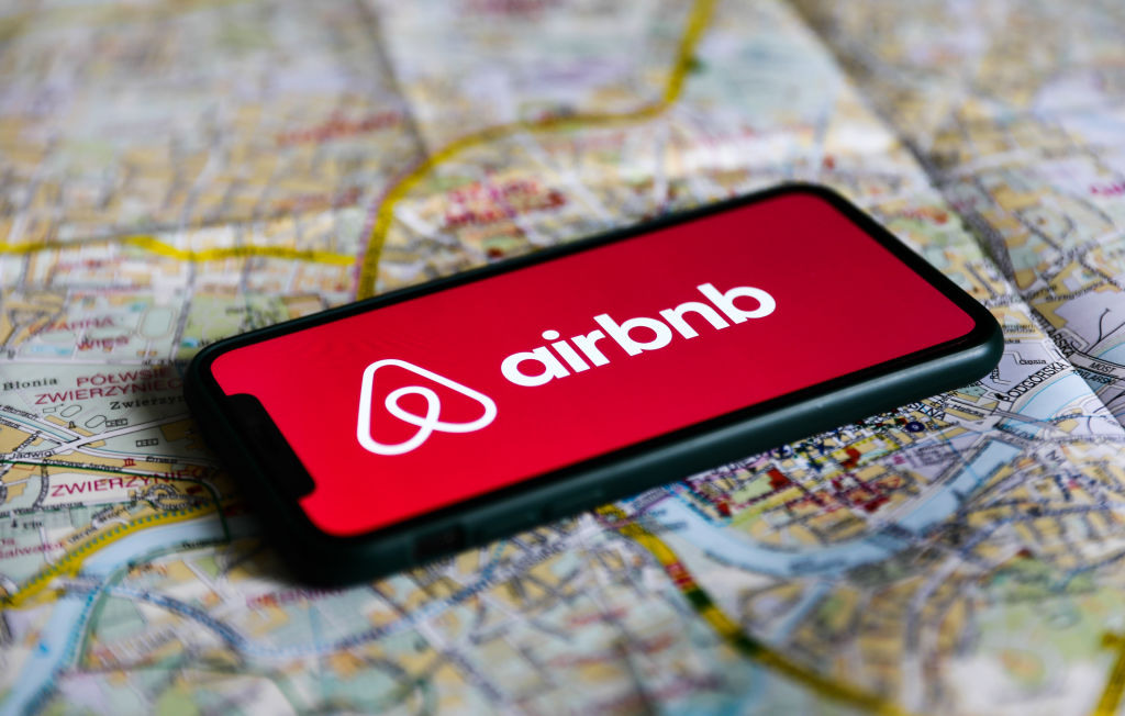 Airbnb logo displayed on a phone screen