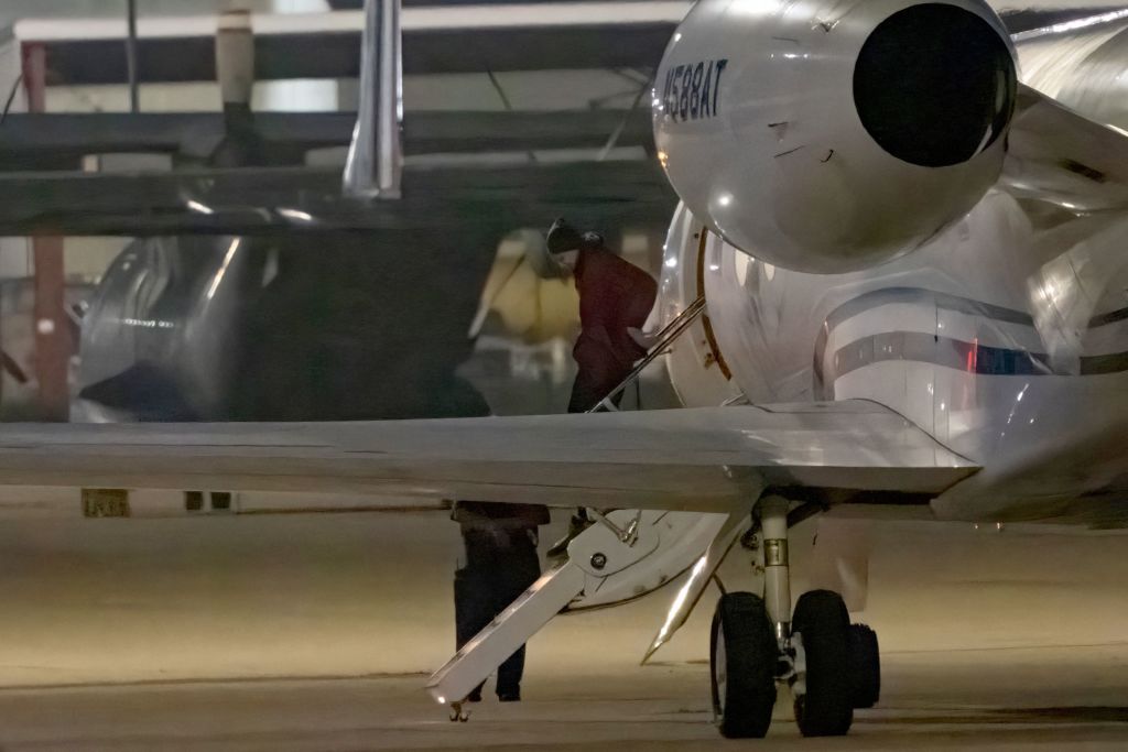 Brittney Griner gets out of a plane after arriving in San Antonio, Texas