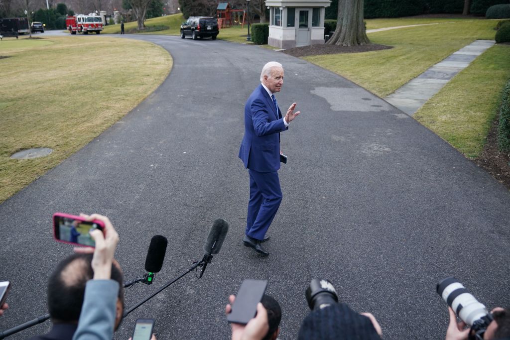 Joe Biden walking away from reporters.