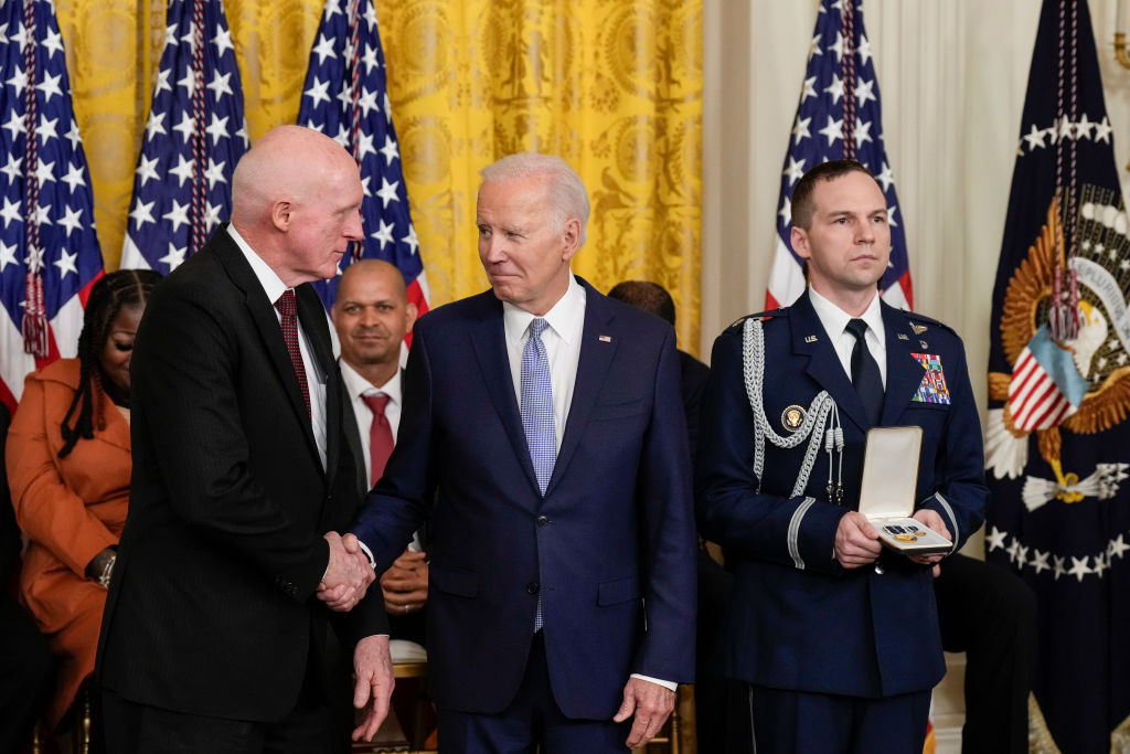 Joe Biden shaking the hand of Rusty Bowers during White House event marking 2nd anniversary of Jan. 6 riot.