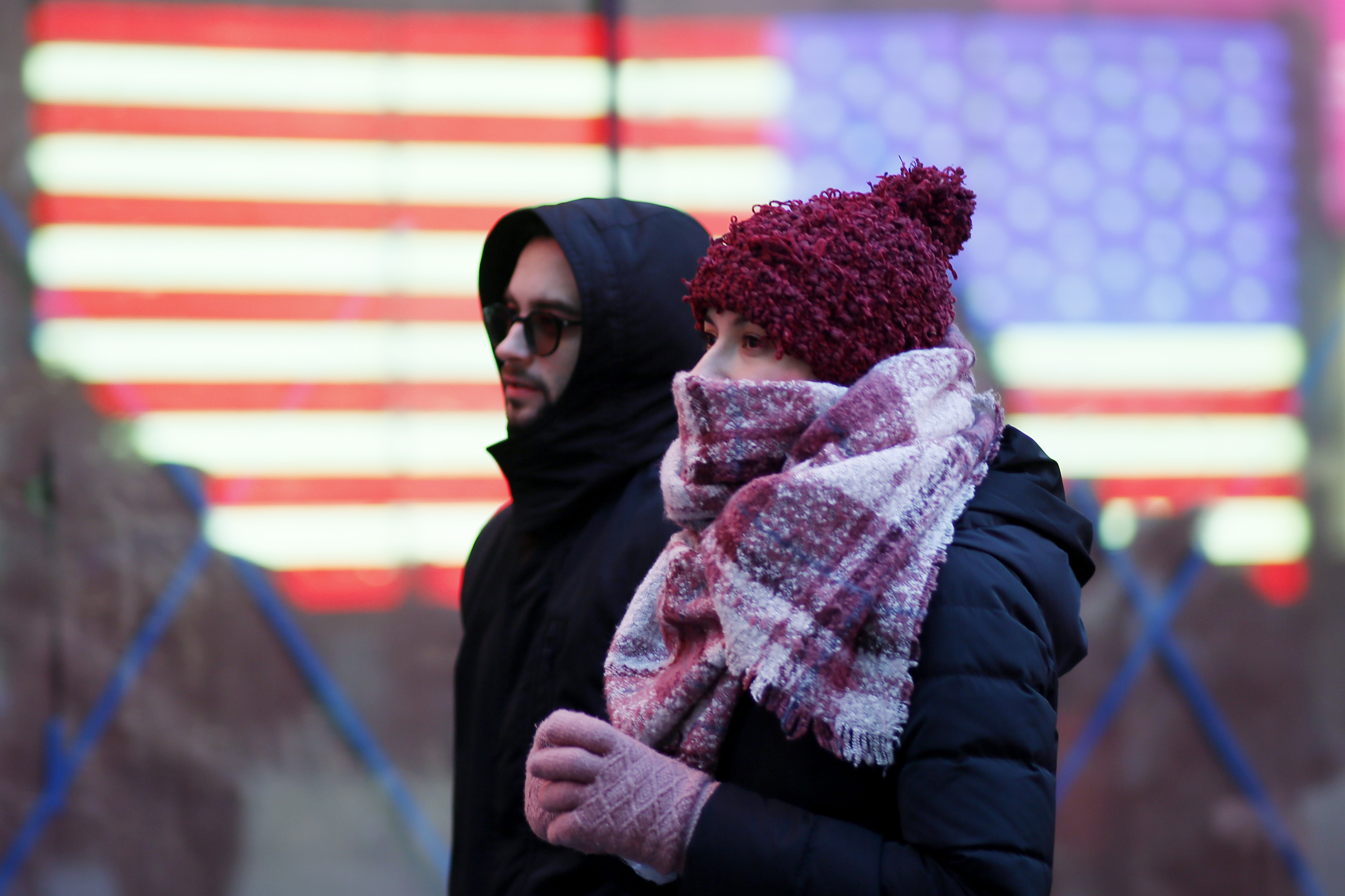 People walk through New York City during frigid temperatures in February. 