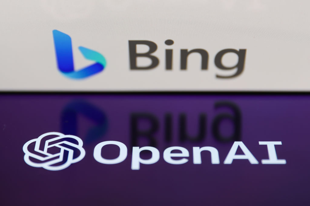 ing logo displayed on a laptop screen and OpenAI logo displayed on a phone screen