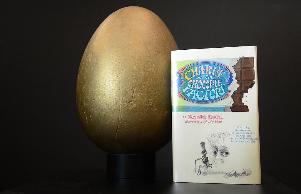 The first edition book &#039;Charlie and the Chocolate Factory&#039; and the original hero Golden Egg from the film &quot;Willy Wonka and the Chocolate Factory&quot;