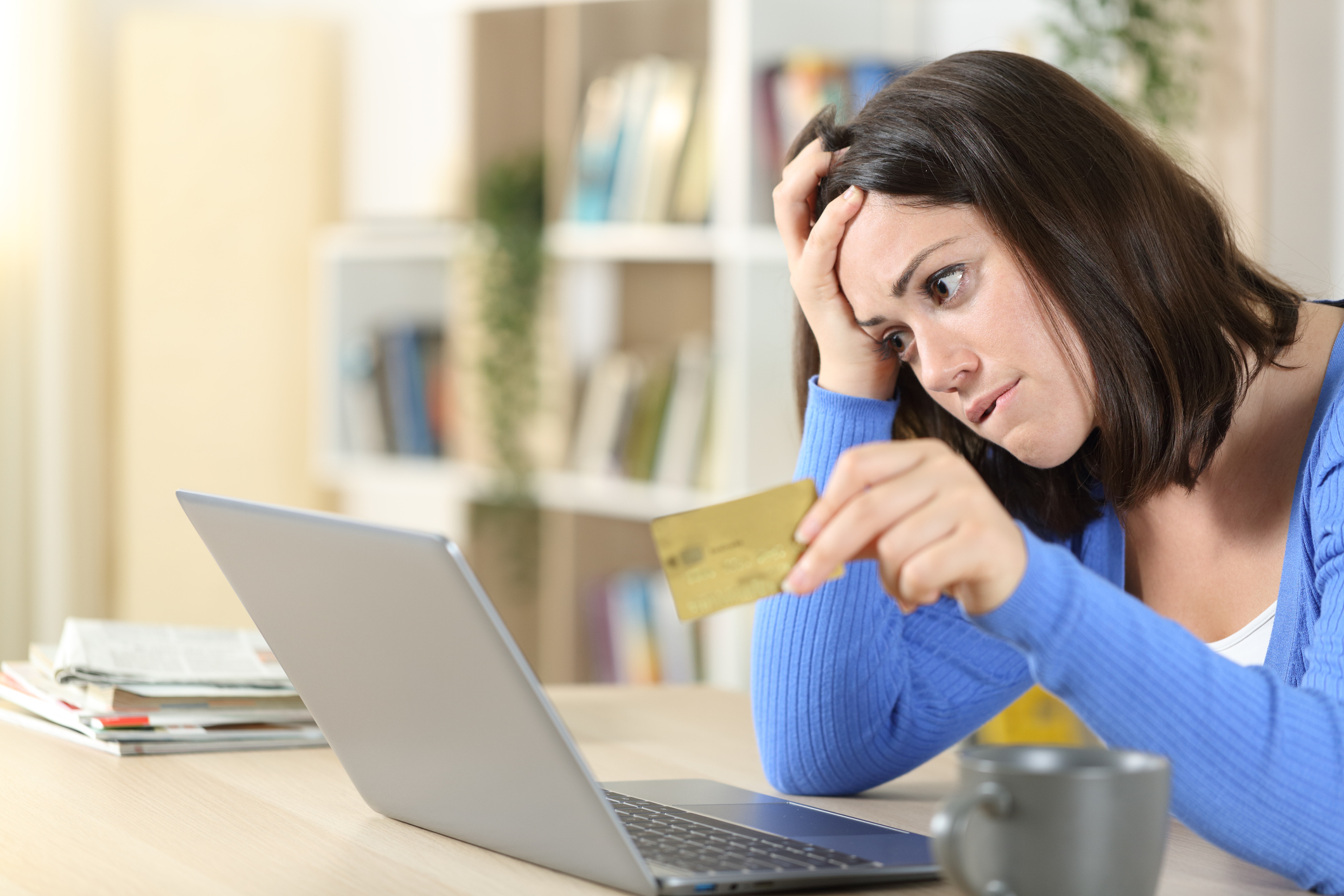 Woman holding credit card. 