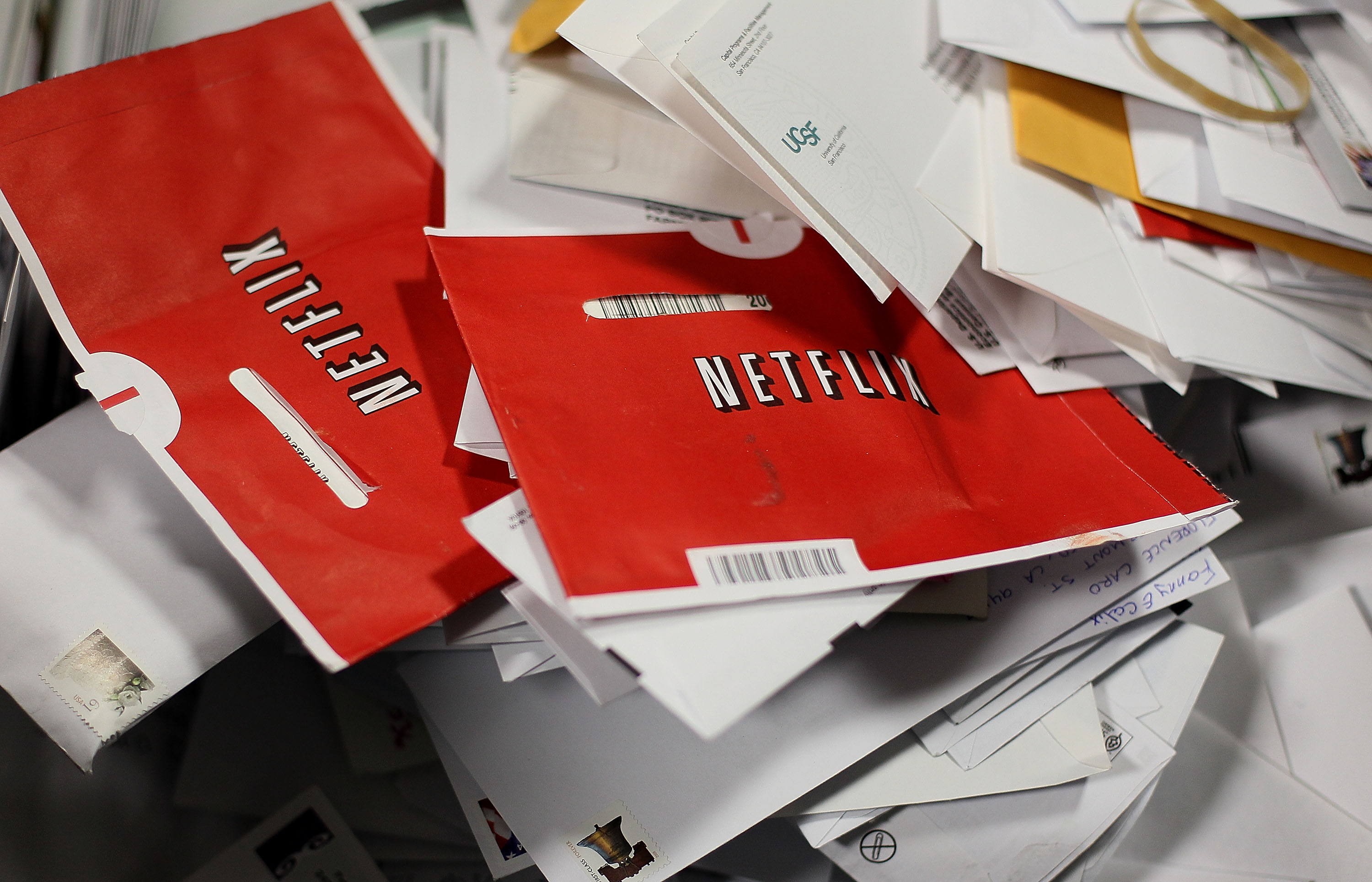 Netflix envelopes in a pile of mail