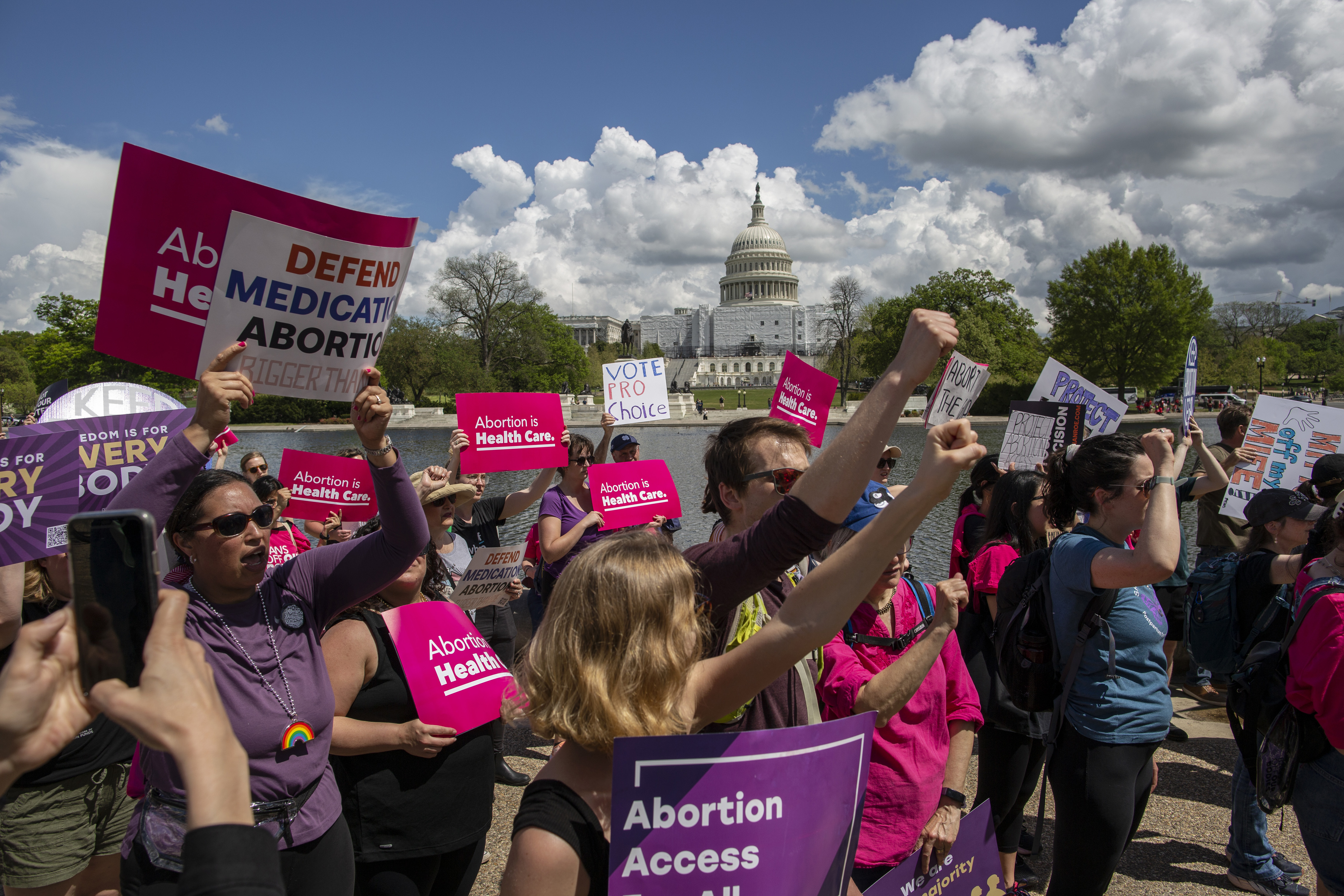 Pro-choice protesters hold signs in Washington