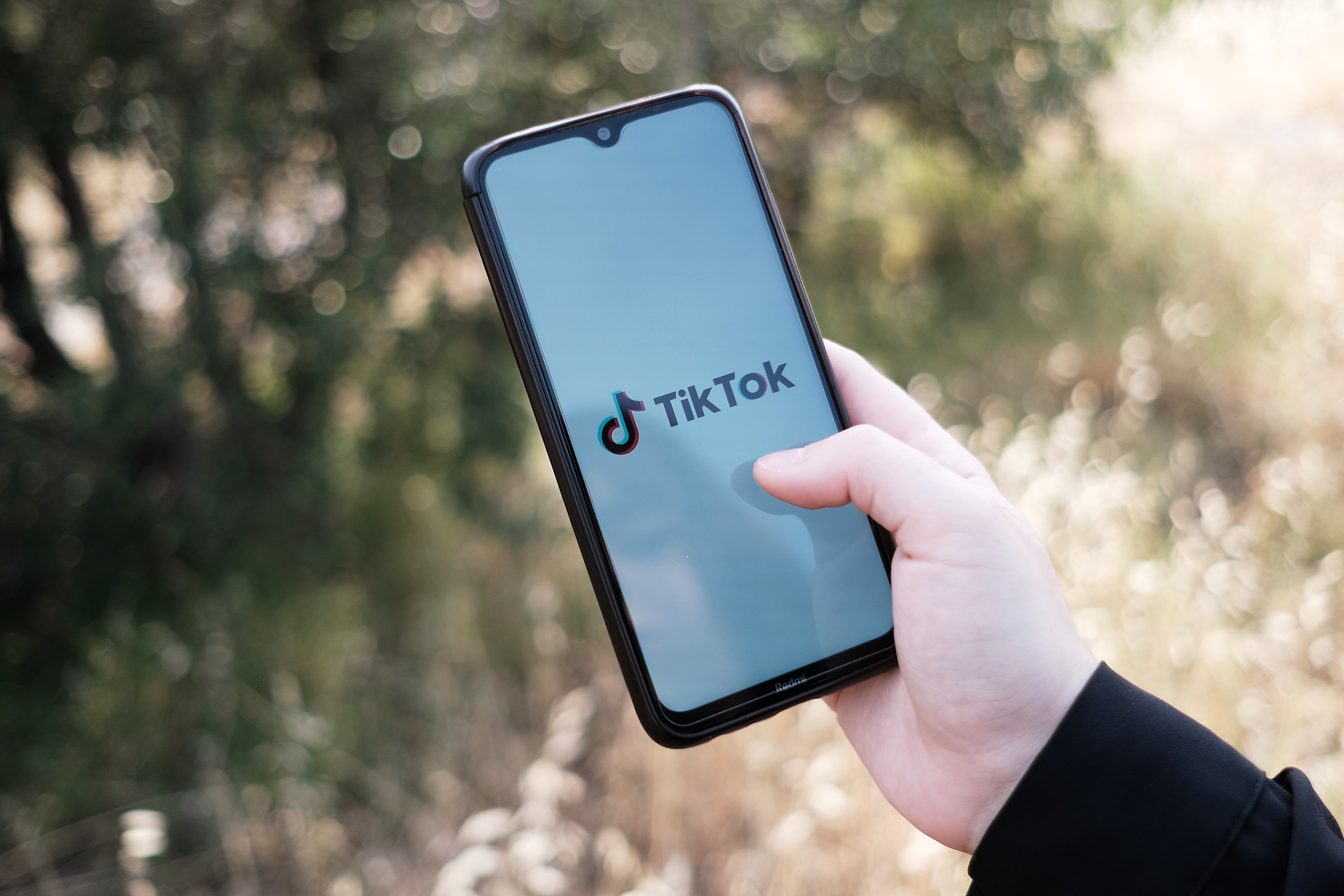 A TikTok logo on a phone screen