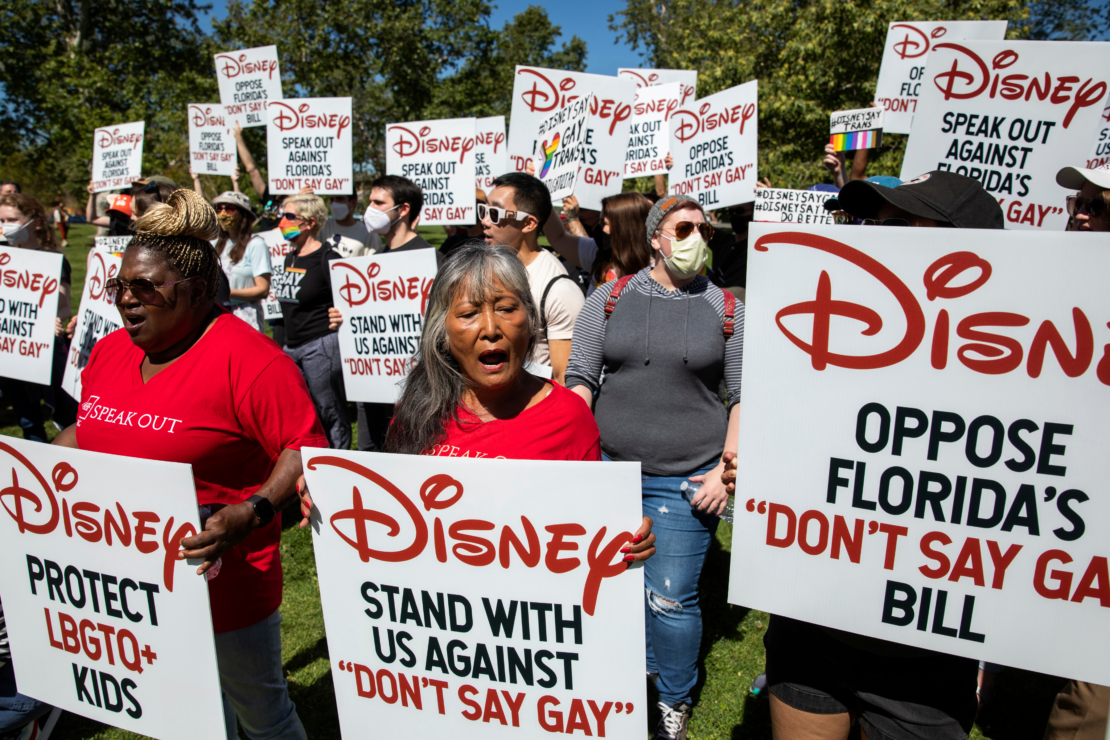 Protesters gather and hold signs urging Disney to protest Florida&#039;s &#039;Don&#039;t Say Gay&#039; bill