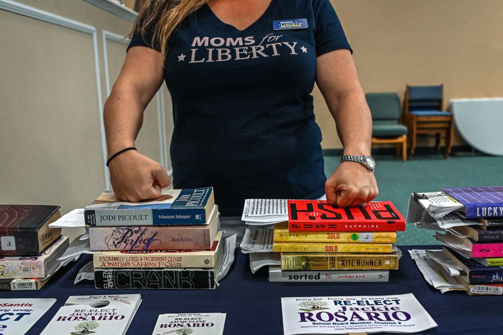 Woman in Moms for Liberty shirt.