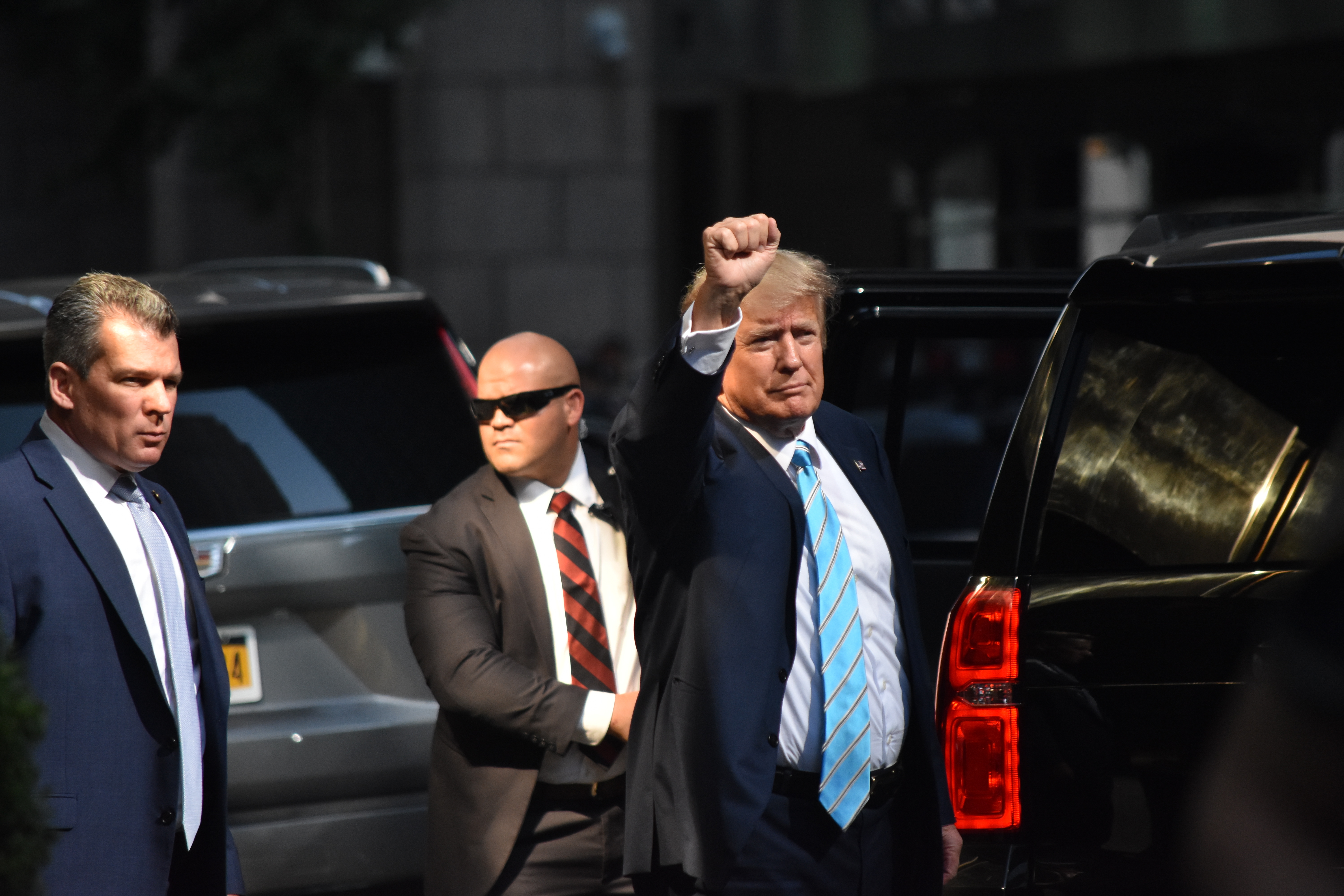 Donald Trump pumps his fist outside Trump Tower