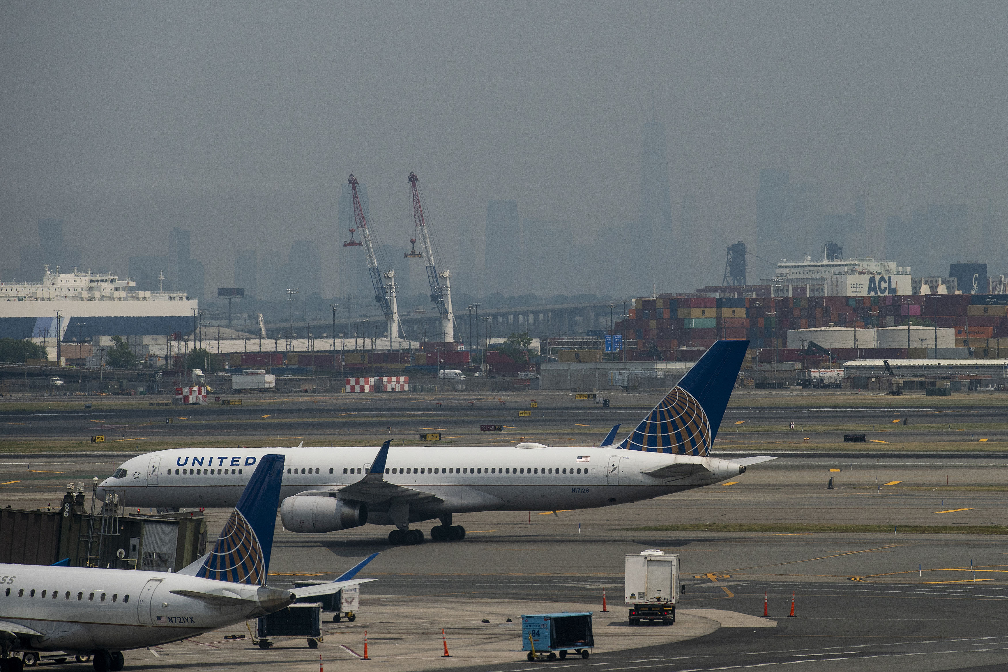 A picture of airplanes on a tarmac at Newark Liberty International Airport