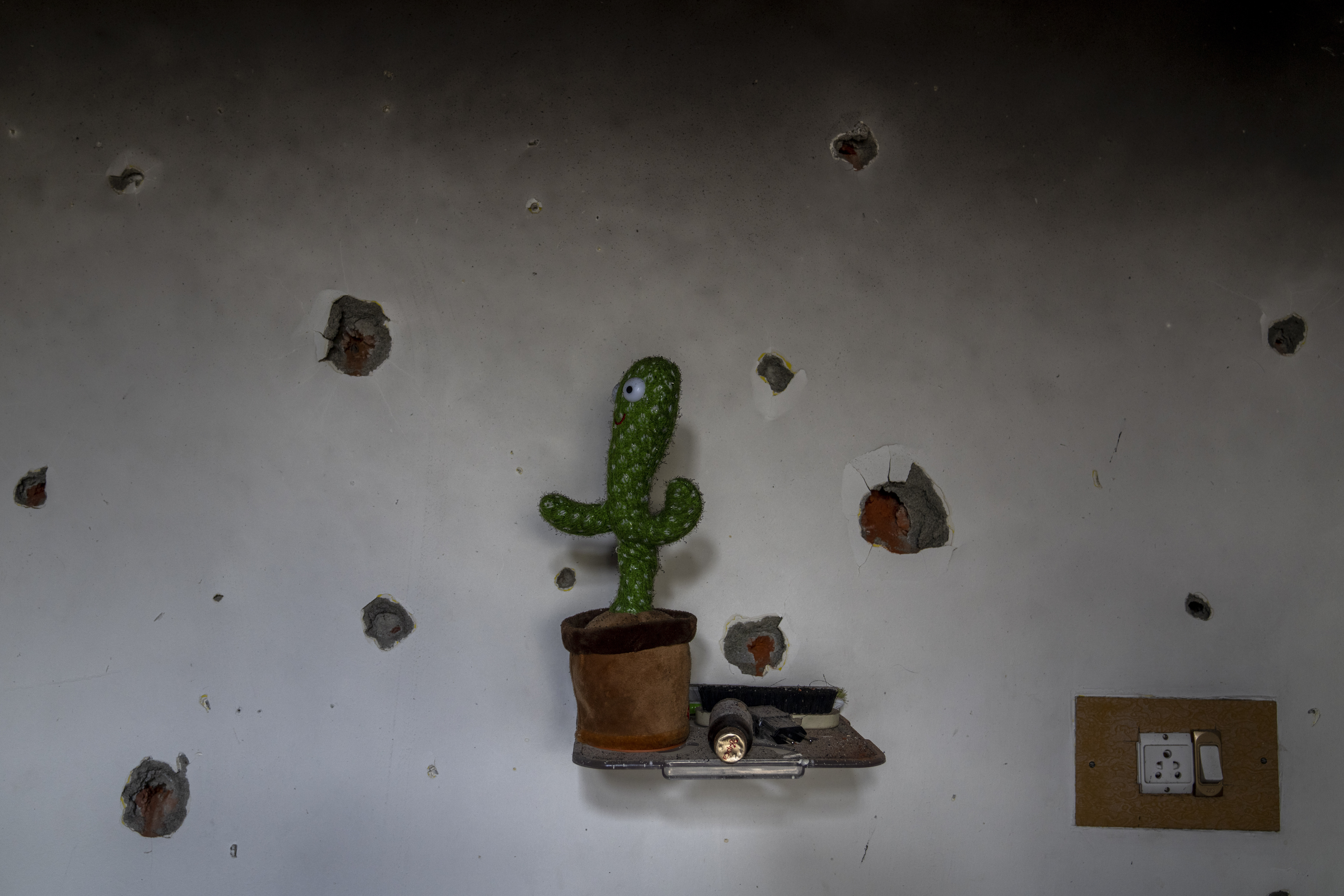 A bullet-riddled wall.