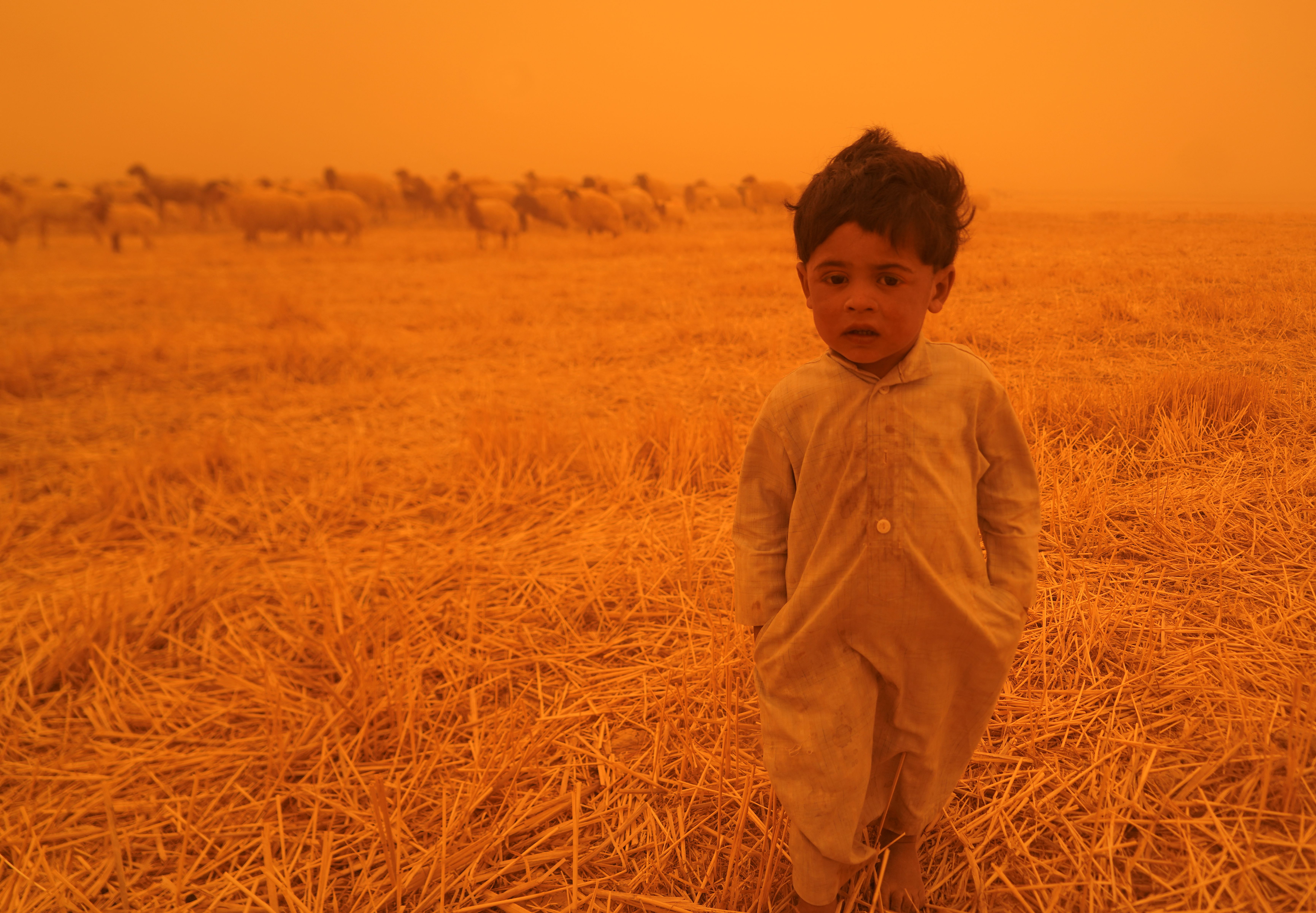 A child in a sandstorm.