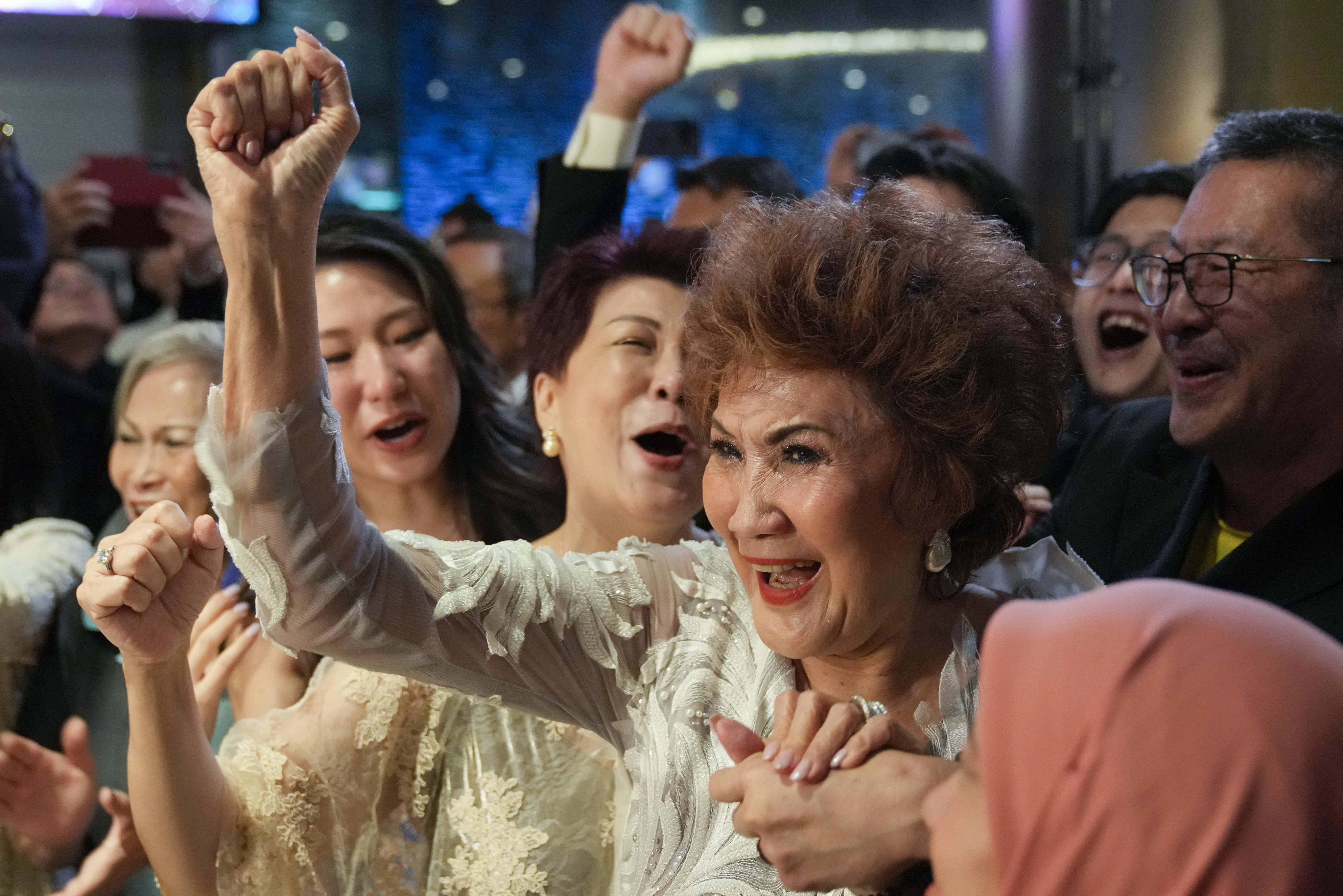 Woman cheering at party.