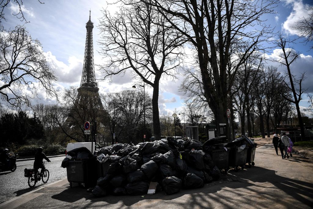 Trash bags in front of the Eiffel tower.