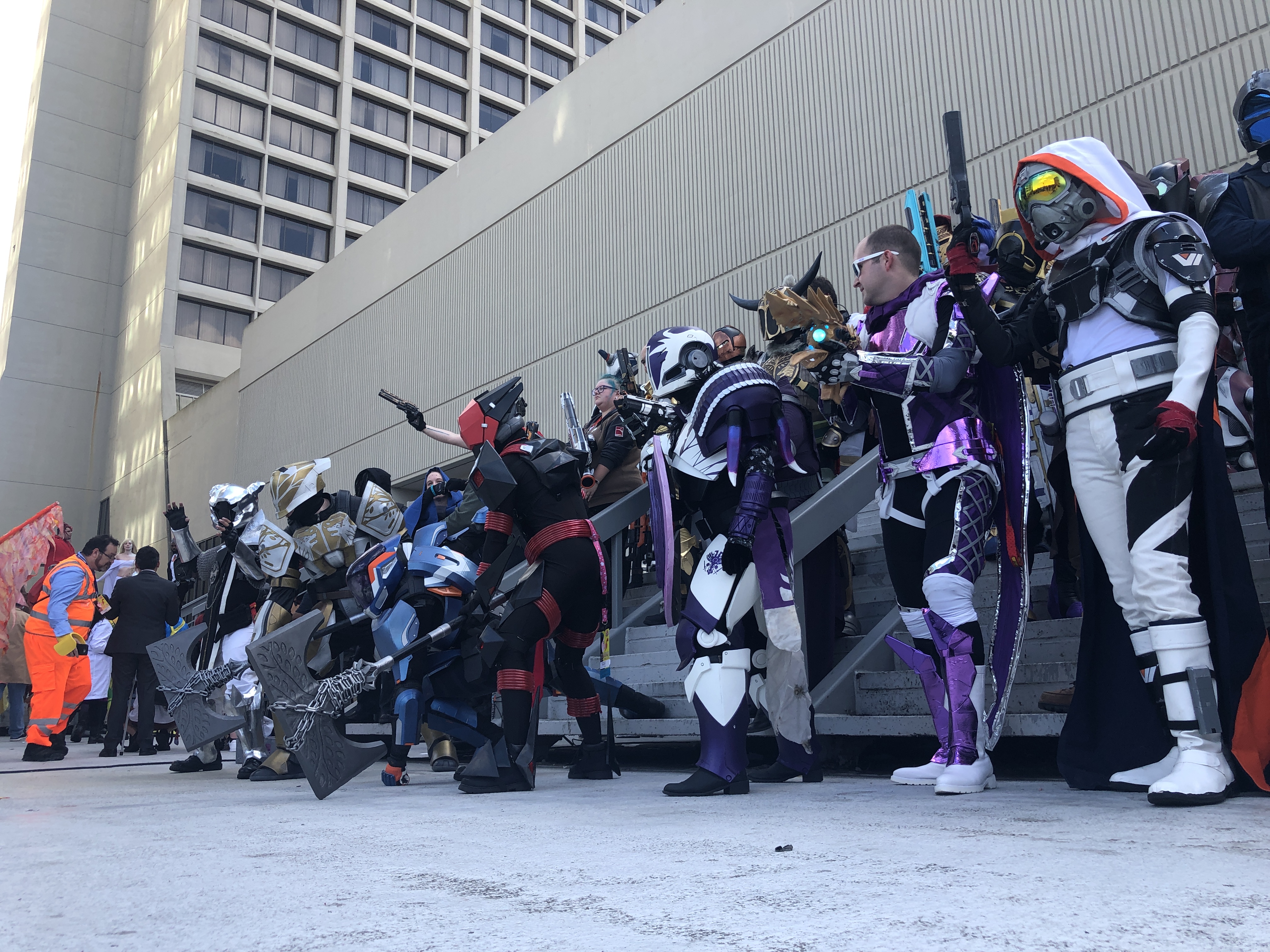 Cosplayers suited up in armor from the video game Destiny pose for cameras at Dragon Con in 2019.