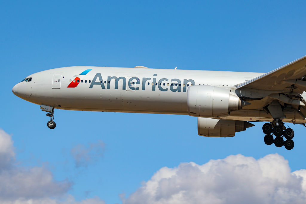An American Airlines plane flies over London.