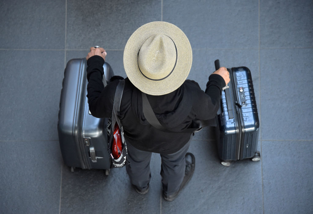 A man with two suitcases.