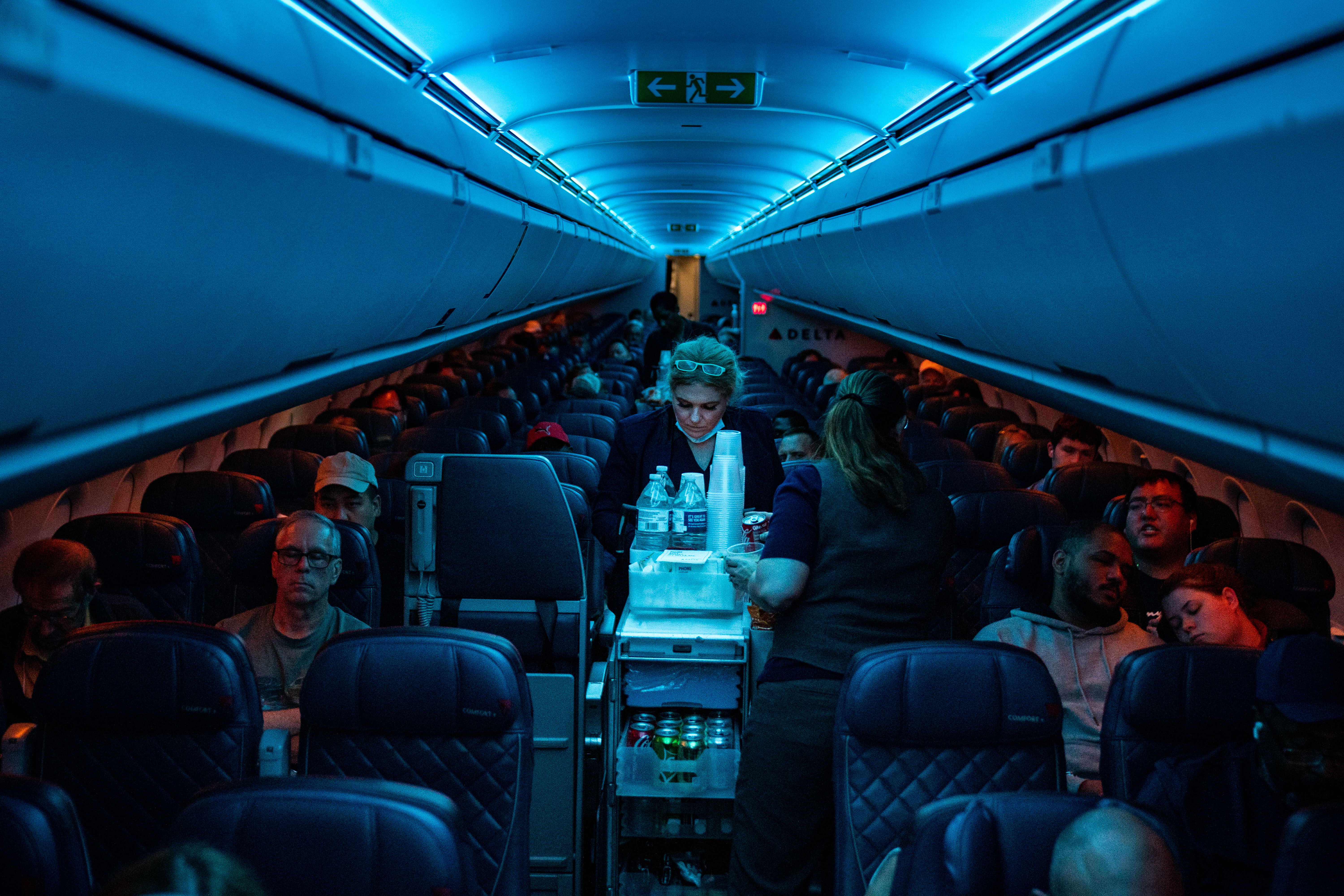 A flight attendant on an airplane.