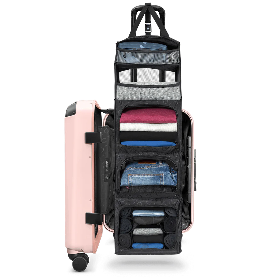 The Carry-On Closet suitcase with clothes inside of it