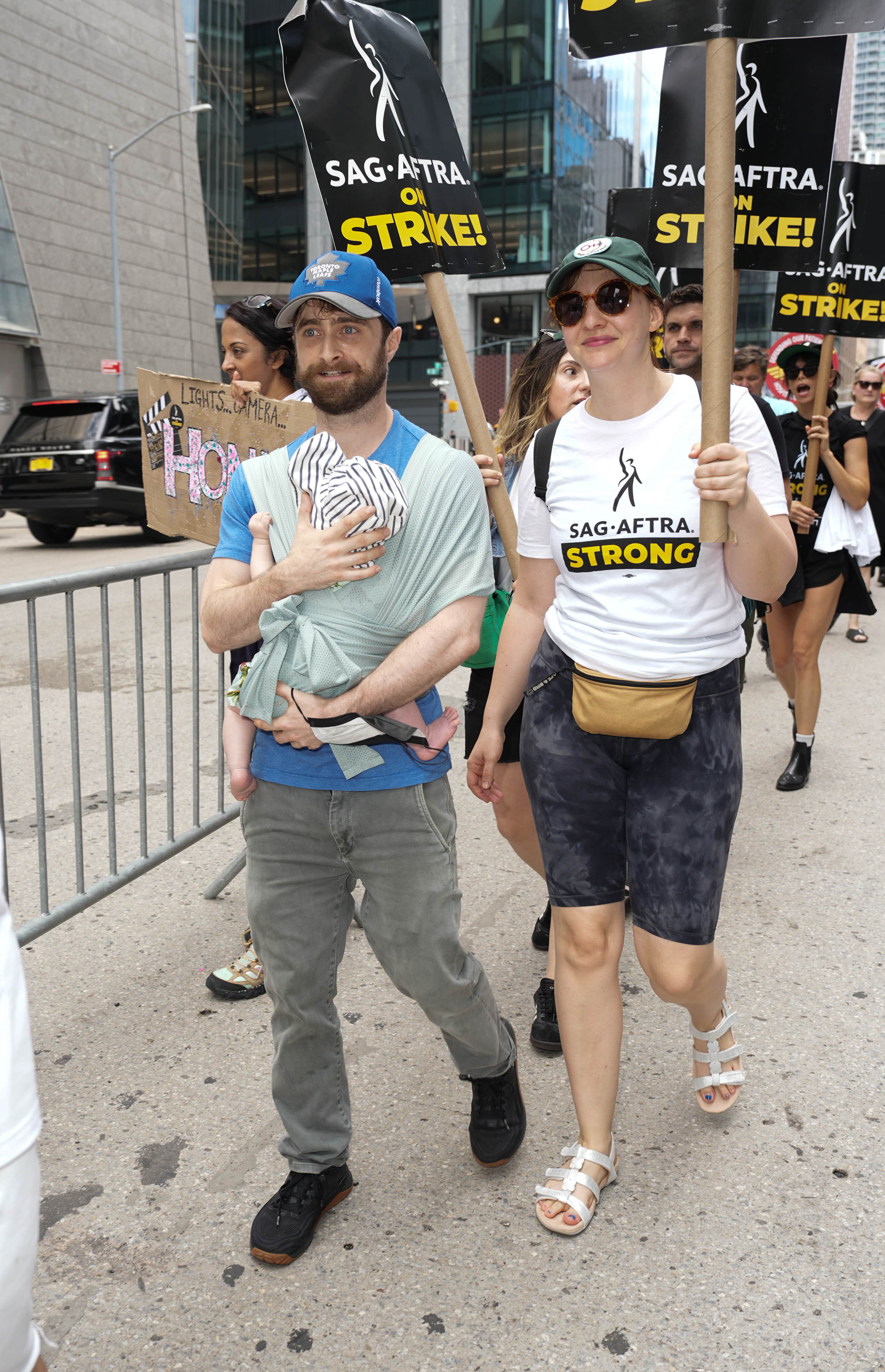 Daniel Radcliffe and Erin Darke on a picket line in New York City.