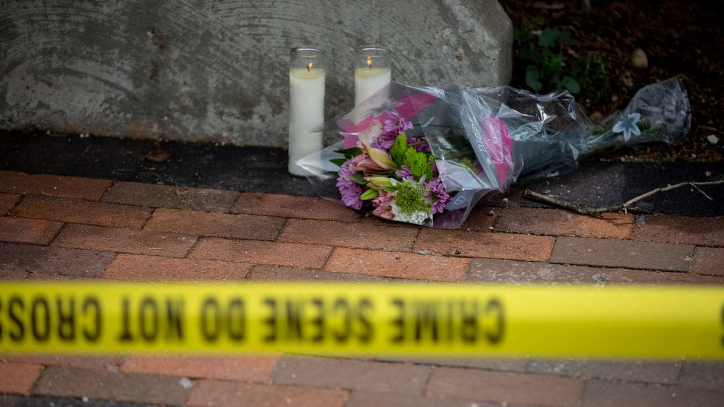 Flowers at the scene of the Highland Park shooting