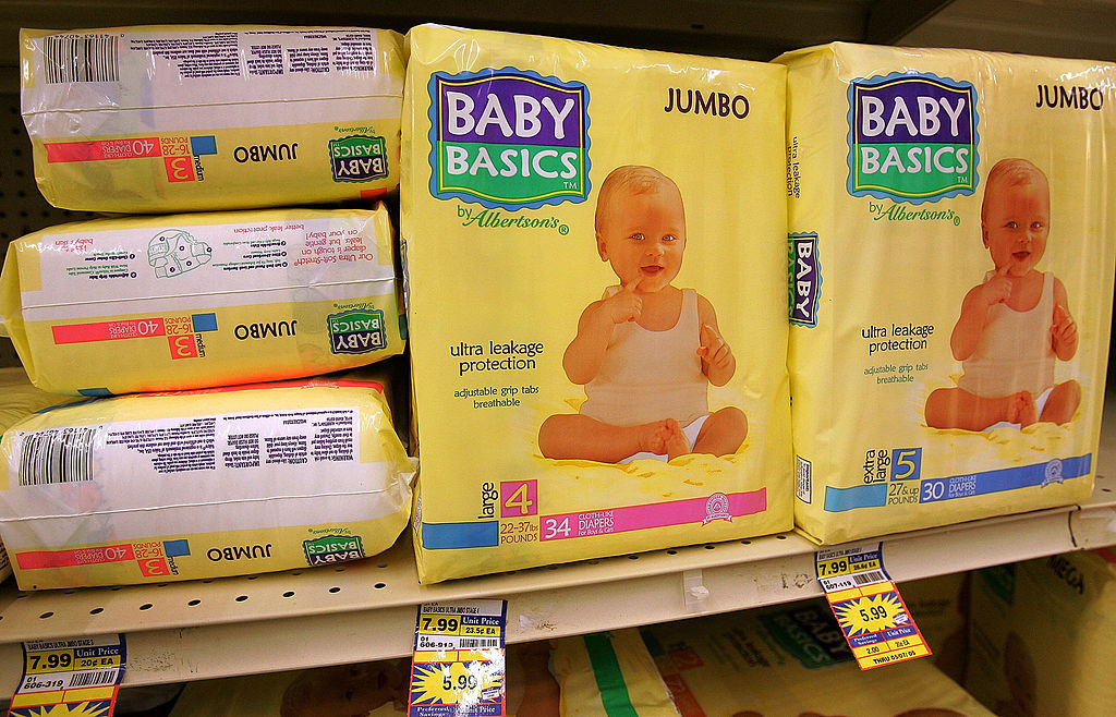 Baby diapers on a store shelf.