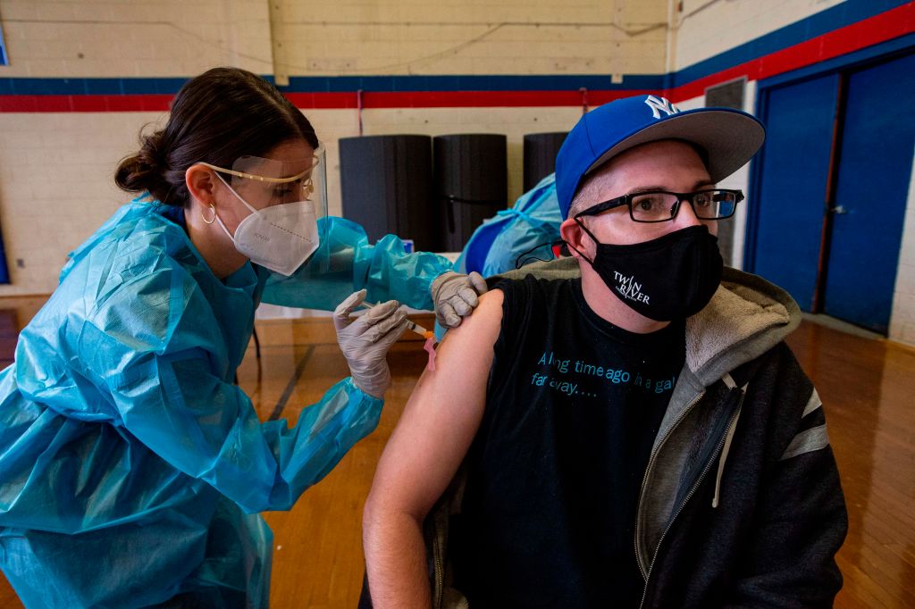A man receives a COVID-19 vaccine shot.