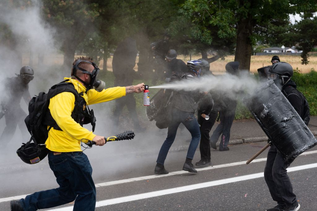 Demonstrators clash in Portland on Sunday.