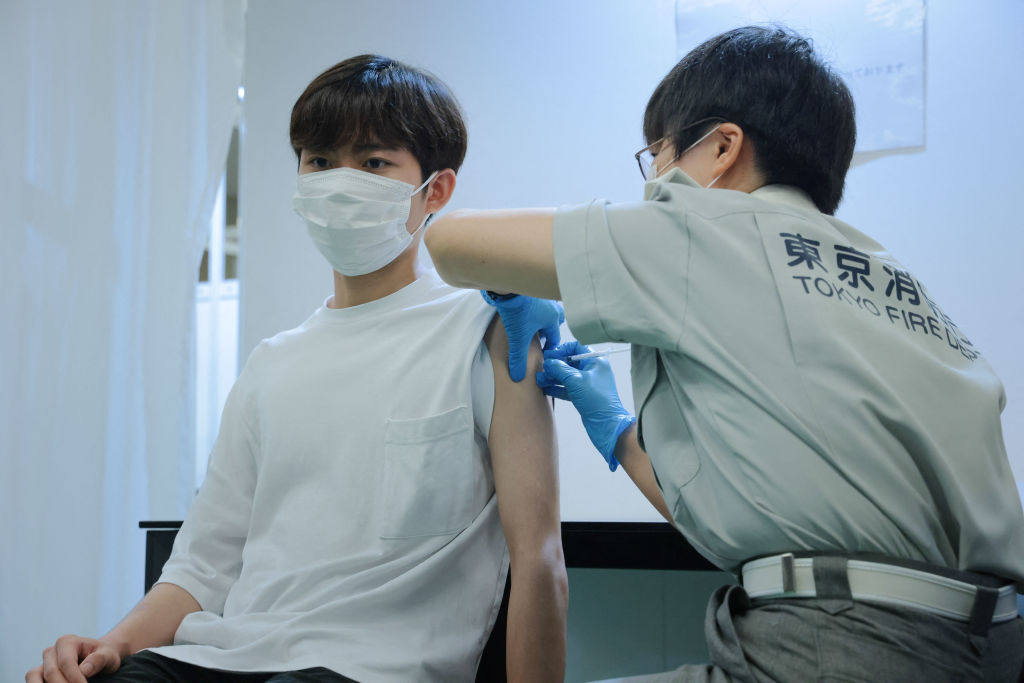 COVID-19 vaccine is administered at Aoyama University in Tokyo