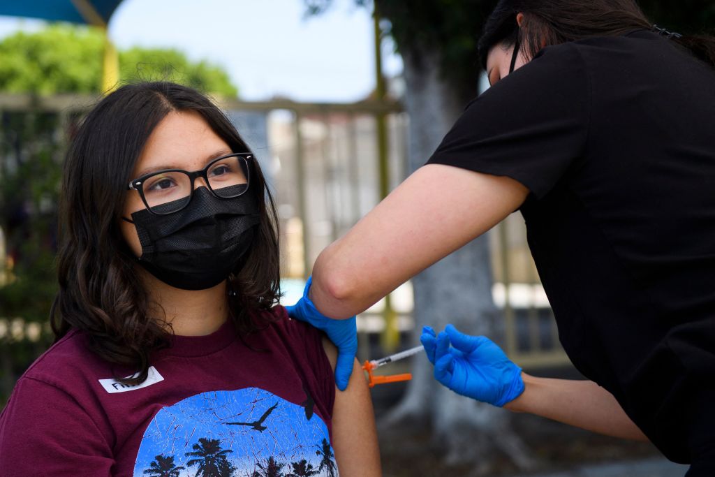 16-year-old Audrey Romero receives a COVID-19 vaccine