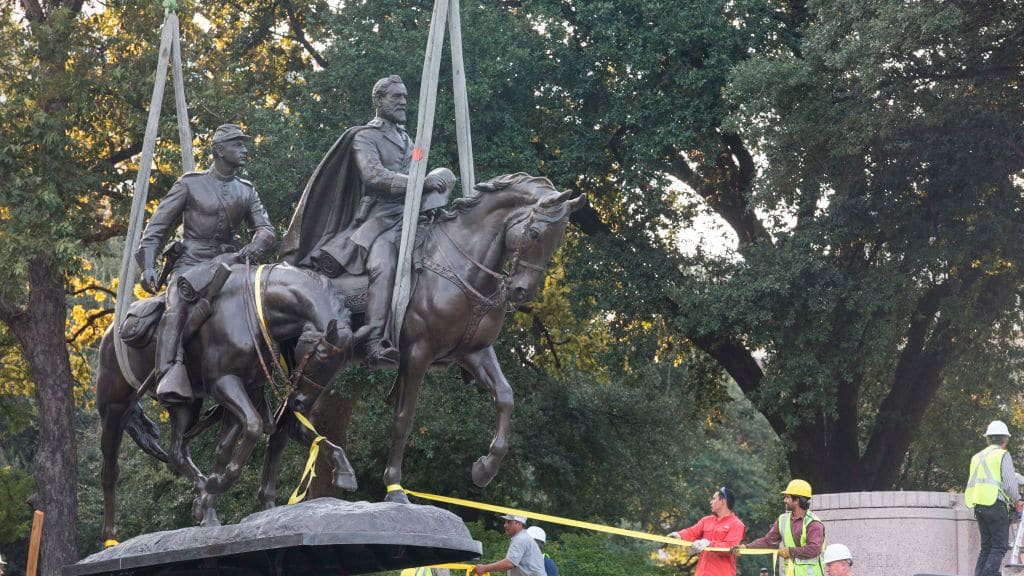 The statue of Robert E. Lee being removed from a Dallas park.