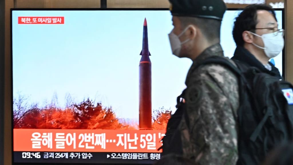 File footage of a North Korean missile launch airs on South Korean TV.