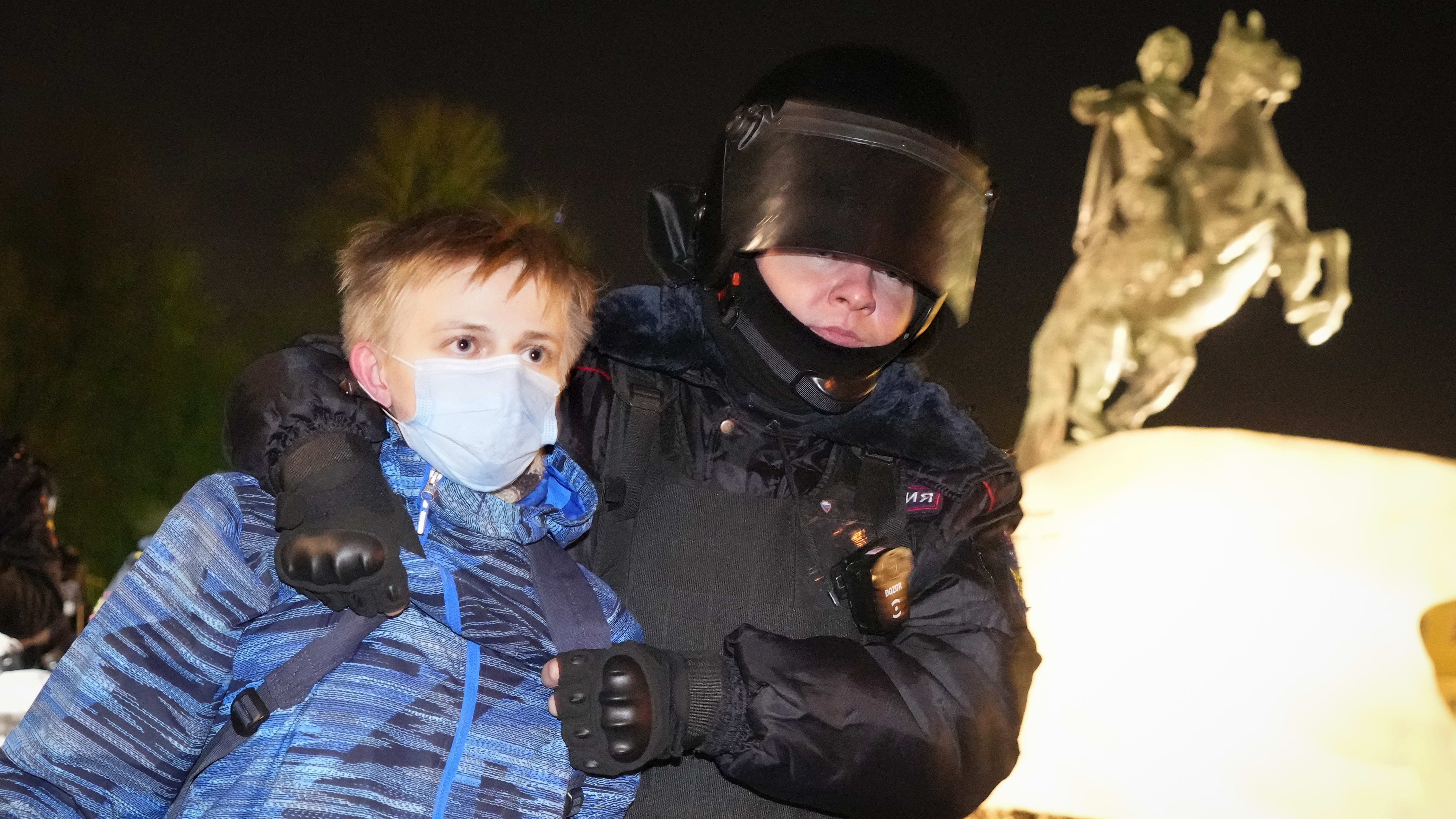 A Russian youth is arrested at an anti-war protest in St. Petersburg on Feb. 28.