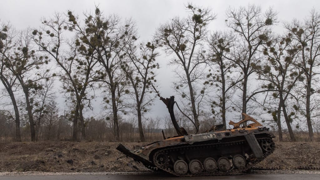 A destroyed Russian military vehicle is seen on a road on the outskirts of Trostyanets, Ukraine.